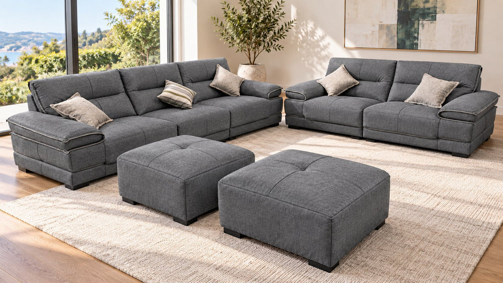 Olivia sofa set with two sofas and two ottomans in a living room — Monelli 10 — Charcoal Grey