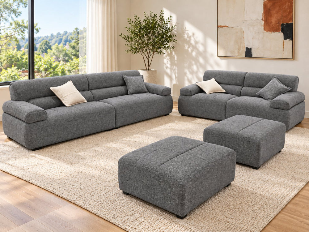 Ava 3-seater + 2-seater + 2 ottomans in a living room — Monelli 10 — Charcoal Grey