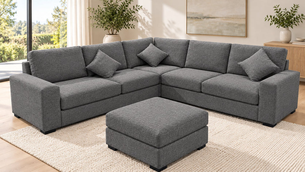 Chloe corner sofa with one matching ottoman in a living room — Monelli 10 — Charcoal Grey