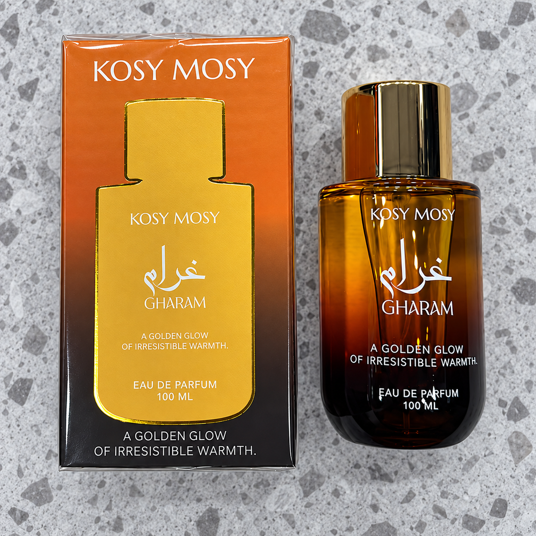 Kosy Mosy Gharam eau de parfum 100ml amber bottle beside its orange and gold box, product code KMD112
