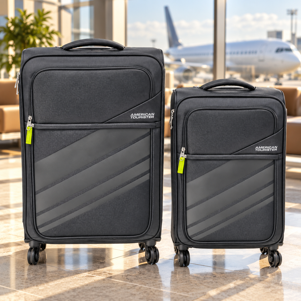 American Tourister charcoal softside suitcases in an airport lounge