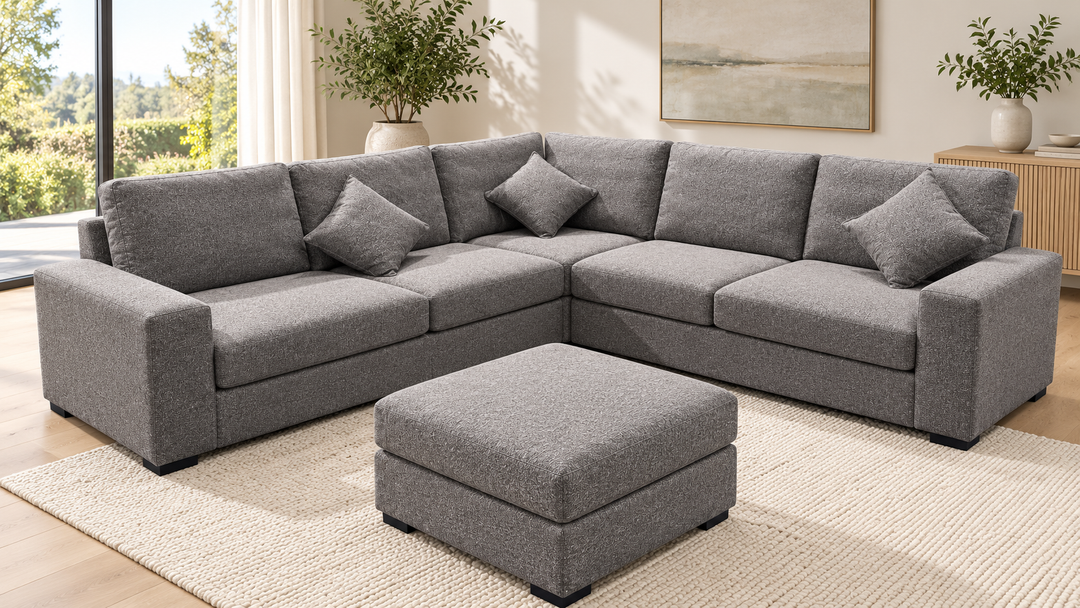 Chloe corner sofa with one matching ottoman in a living room — showroom grey upholstery