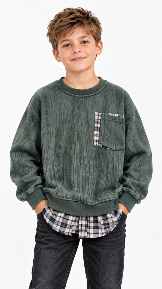 Child model wearing green 2677 textured sweatshirt with plaid pocket and hem