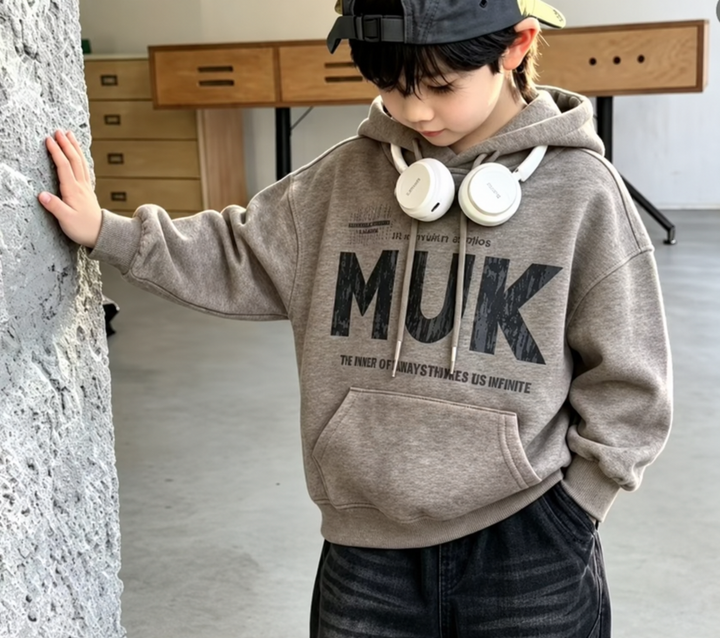 Kids MUK graphic hoodie in taupe marl – model wearing view