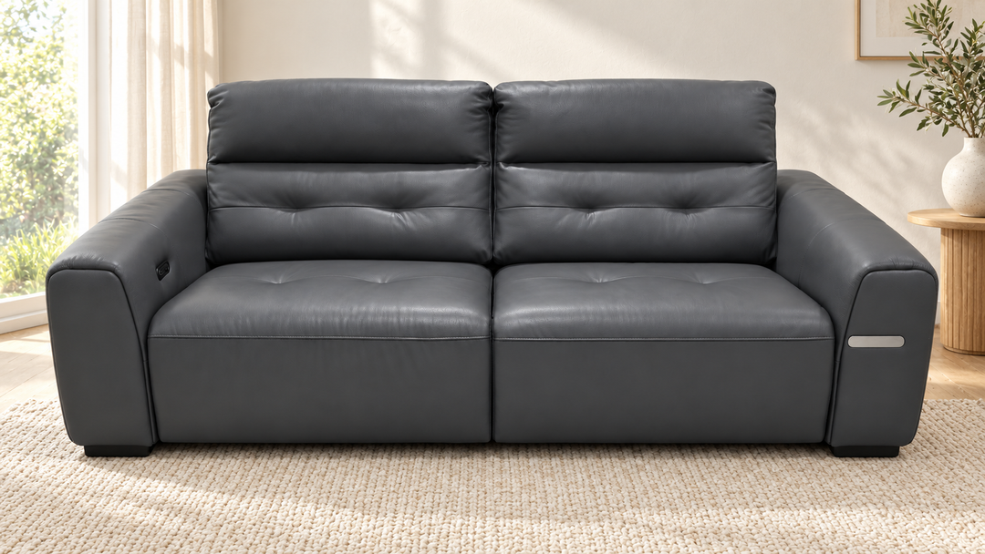 Leo two-seater recliner sofa in charcoal, shown in a living room
