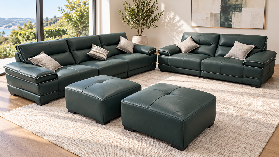 Olivia sofa set in a living room — two sofas and two ottomans in showroom green upholstery