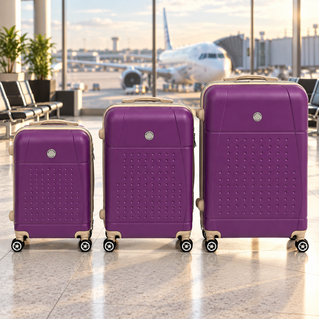 Rocklands London purple suitcases in 20 25 and 29 inch sizes at an airport departure lounge